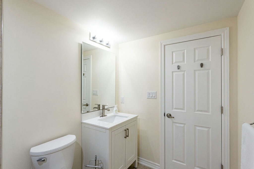 modern minimalist bathroom renovation with white and cream theme