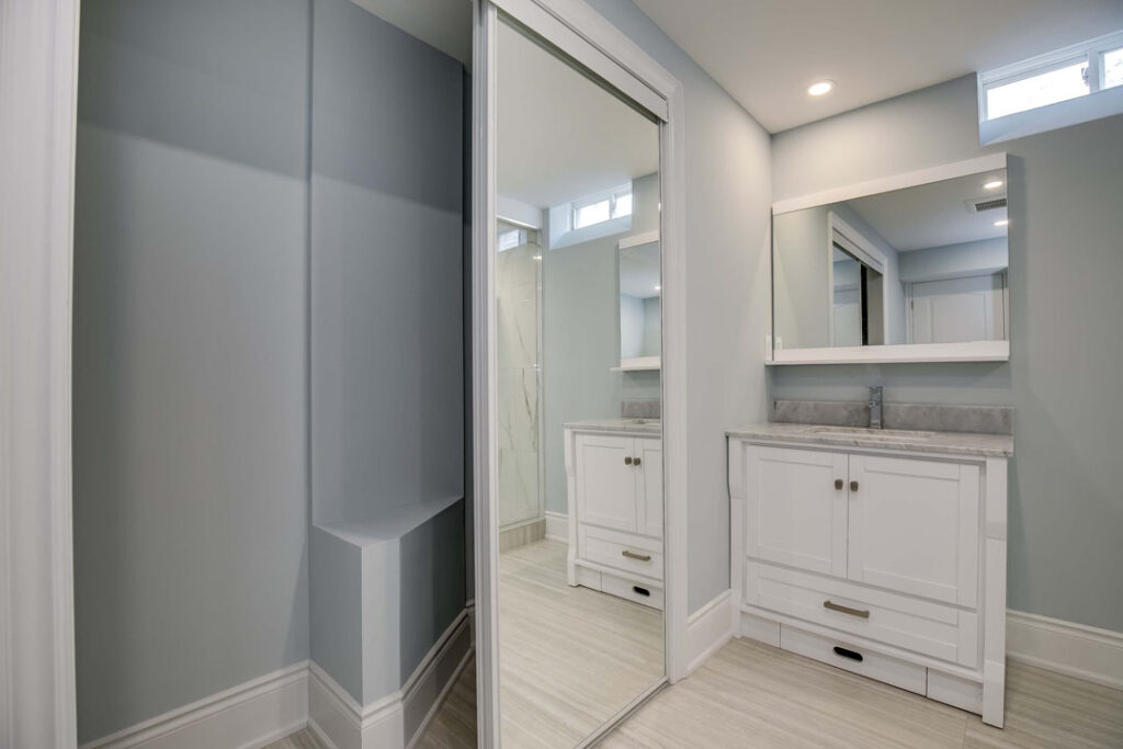 luxury bathroom sliding closet with mirror door