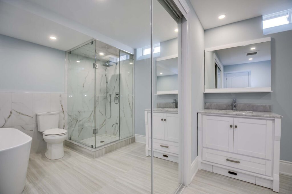 high end bathroom storage vanity with mirror and toilet